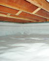 a moisture barrier installed on the walls and floors of a crawl space in Monroe
