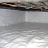 A crawl space vapor barrier has been installed on the walls and floors of this space in Mountlake Terrace.